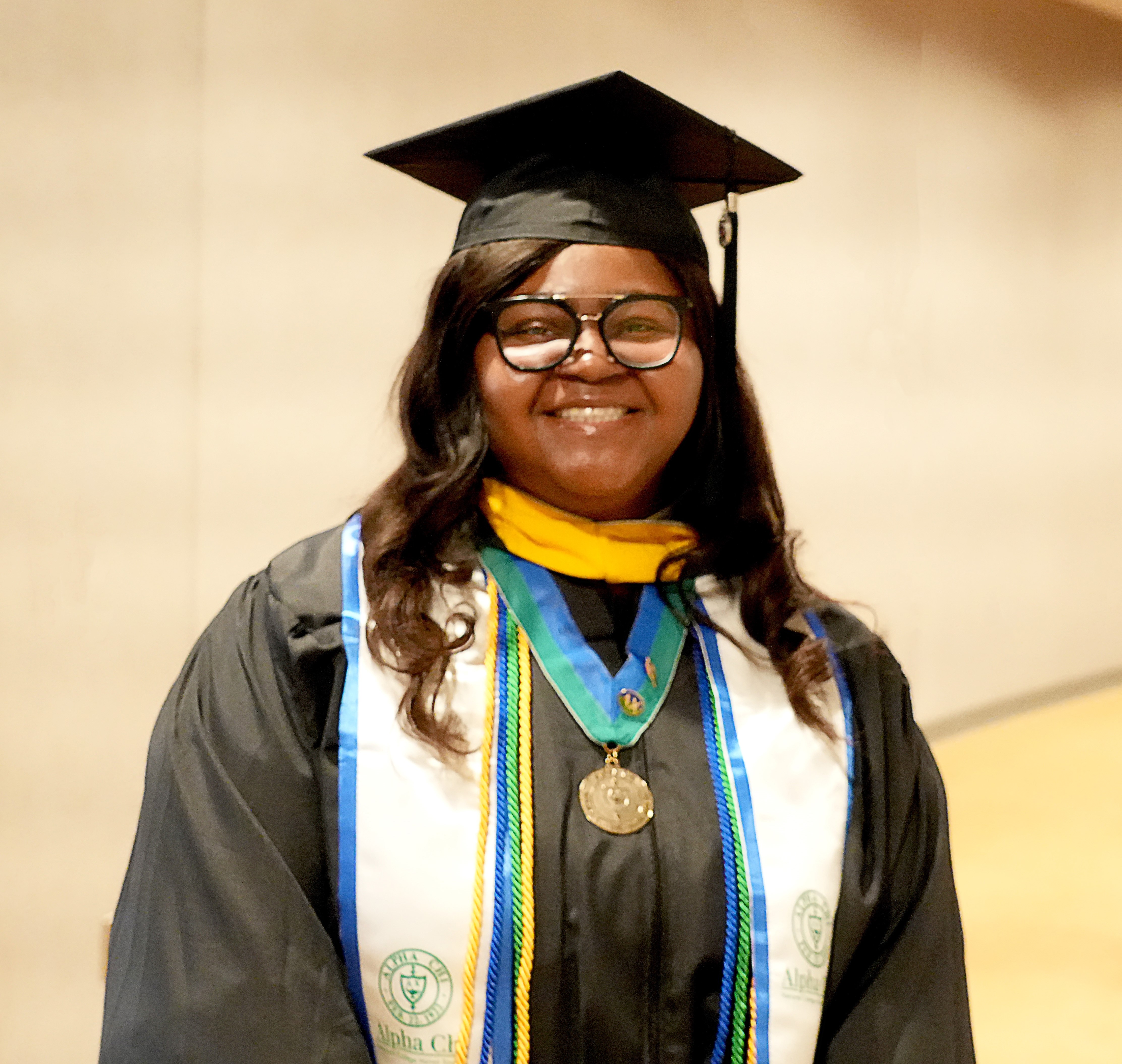 Angel Ibeawuchi in a cap and gown