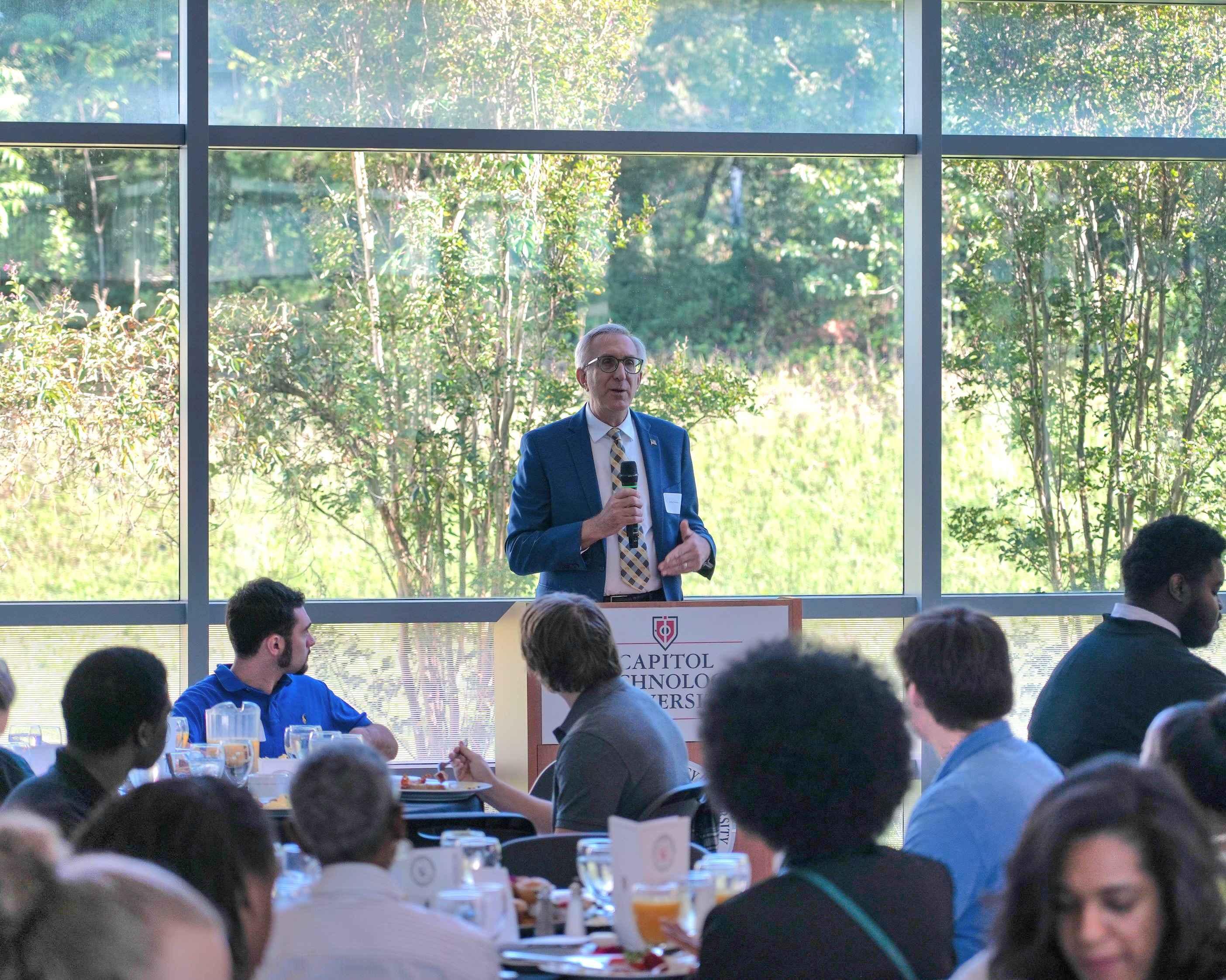 Professor Volosin Speaking at Scholarship Appreciation Breakfast